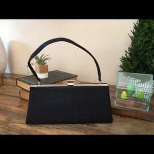 La Regale small black satin clutch